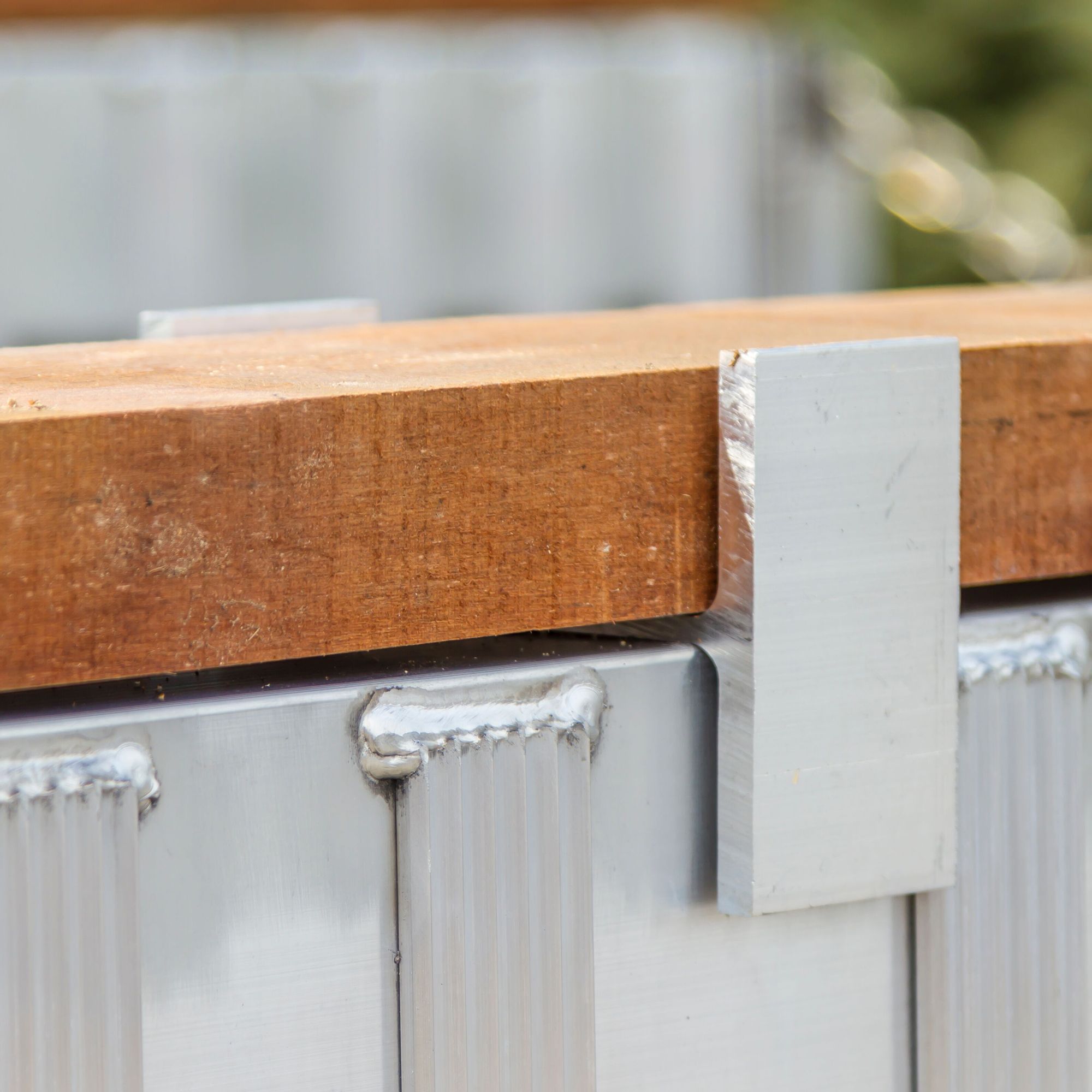 HD Ramps lumber clip in use with dunnage on a load leveler