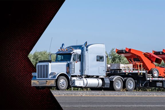 Card image cap for The Advantages of Step Deck Trailers for Heavy Equipment Hauling